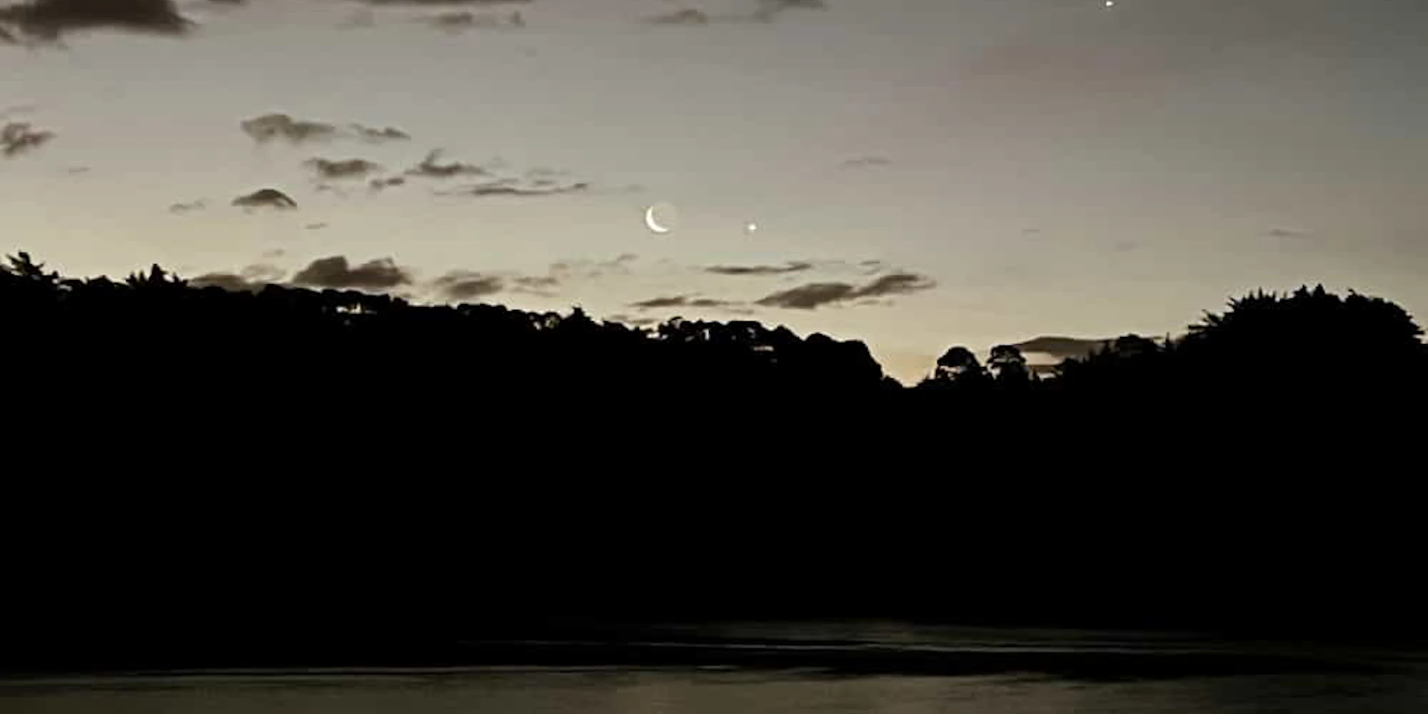 /the lagoon in the evening with double moon